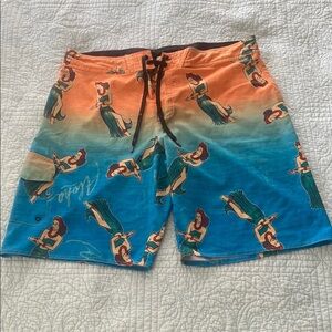 Vibrant Orange and Blue Board Shorts with Swimmer Pattern